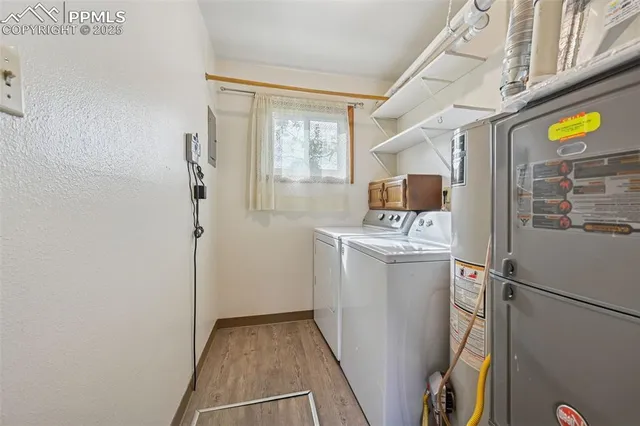 a utility room with closet dryer and washer