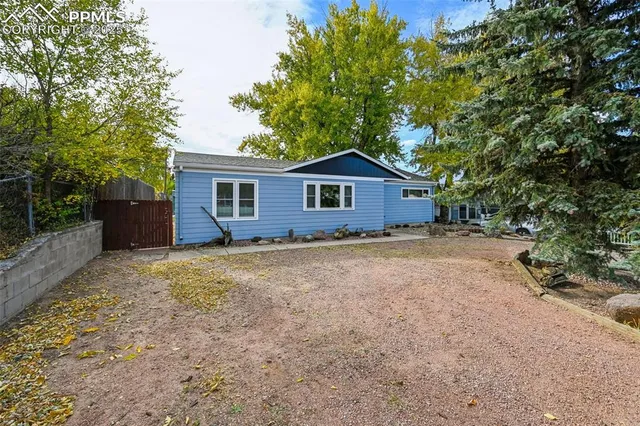 a house with trees in the background