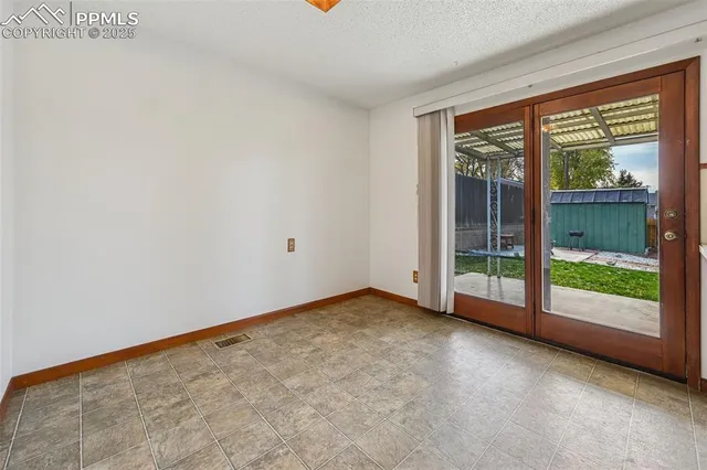 a view of empty room with front door