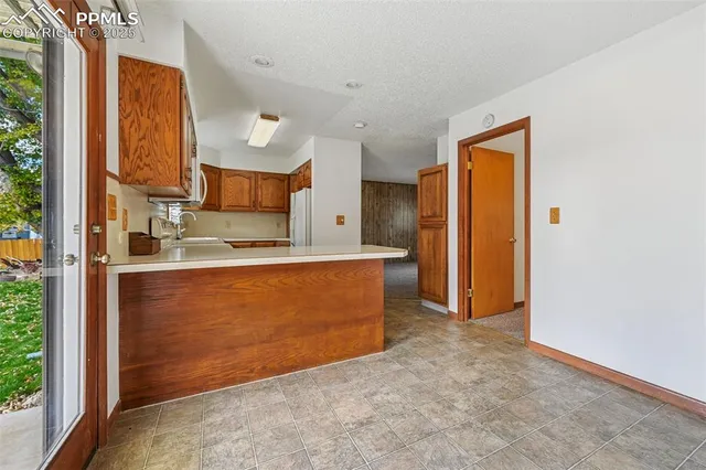 a view of kitchen and utility room