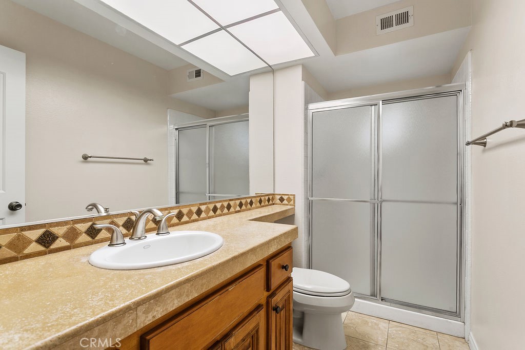 30942 Calle Moraga Laguna Niguel, CA 92677 - Photo 12 of 40 a bathroom with a sink toilet and shower