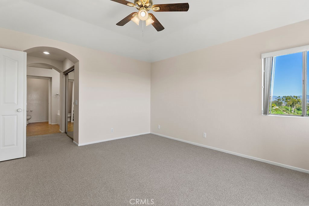 30942 Calle Moraga Laguna Niguel, CA 92677 - Photo 15 of 40 a view of a room with a ceiling fan and carpet