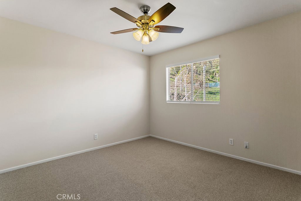30942 Calle Moraga Laguna Niguel, CA 92677 - Photo 22 of 40 an empty room with a window and a fan