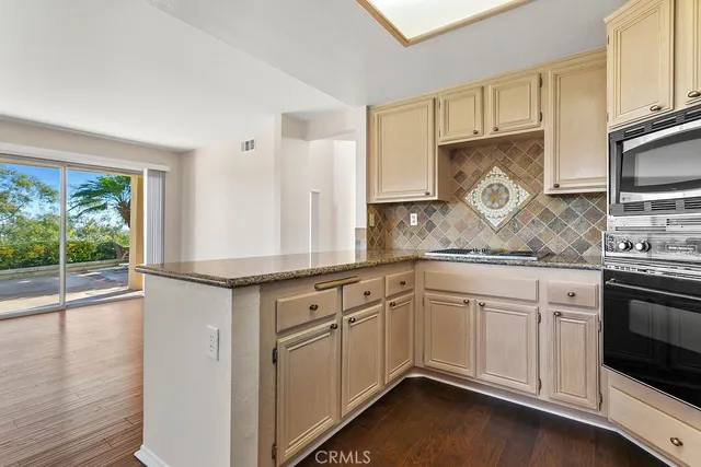 a kitchen with a sink and large window