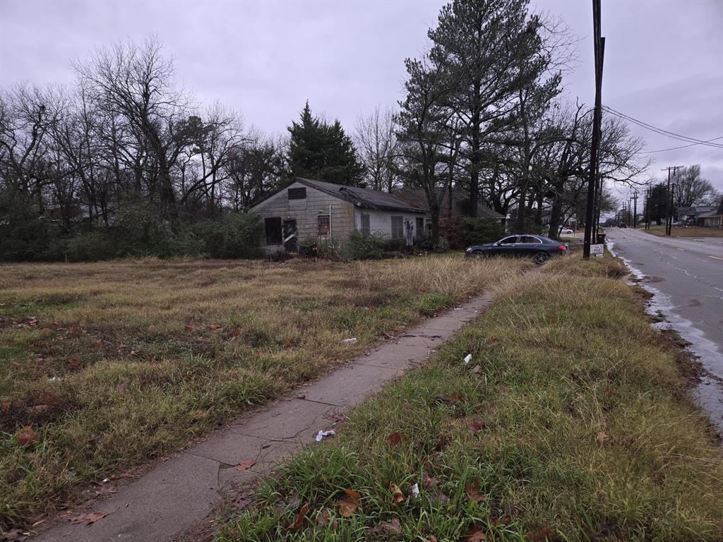 2205 Bonham Street Paris, TX 75460 - Photo 5 of 12 a dirt road with large trees