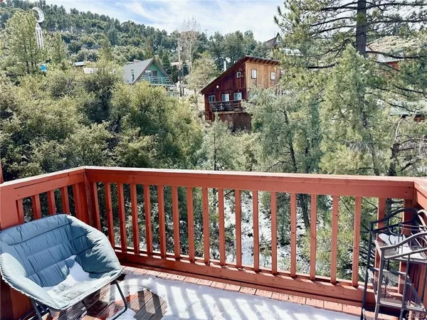 a view of a chair and table in the balcony