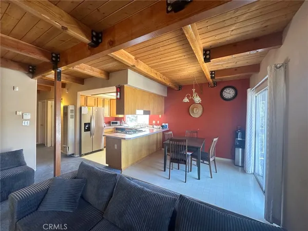 a dining room with furniture and wooden floor