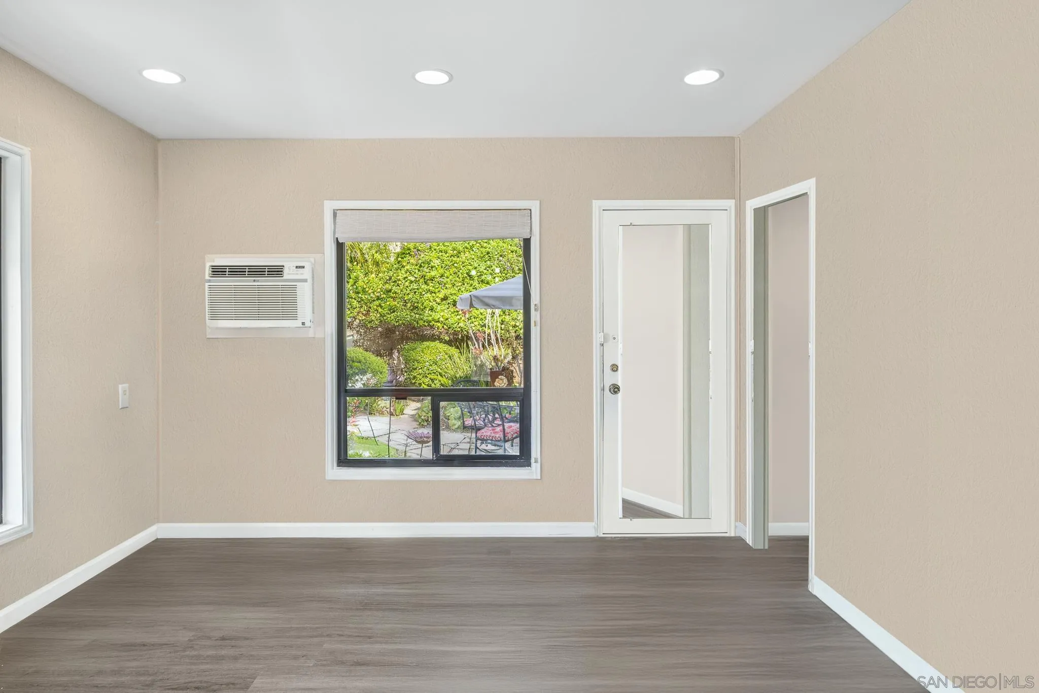 1350 Marshall Road Alpine, CA 91901 - Photo 11 of 23 an empty room with wooden floor and windows