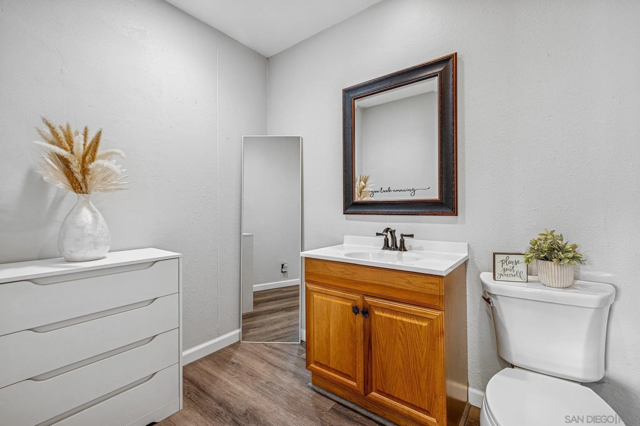 1350 Marshall Road Alpine, CA 91901 - Photo 20 of 23 a bathroom with a toilet sink and mirror