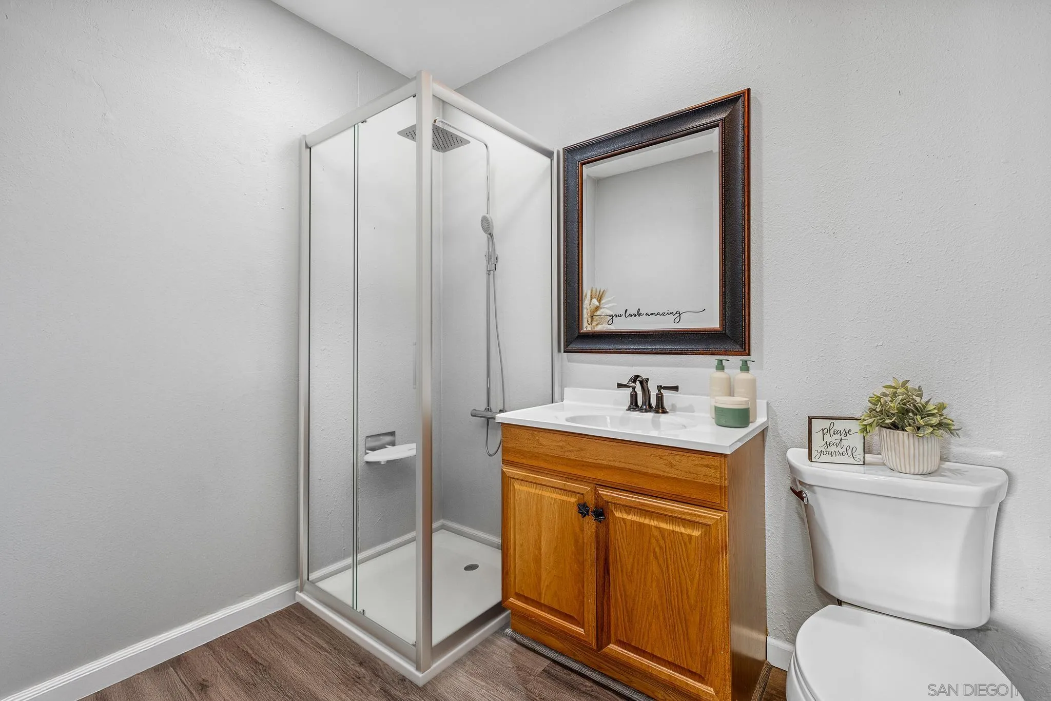 1350 Marshall Road Alpine, CA 91901 - Photo 6 of 23 a bathroom with a toilet sink vanity and mirror