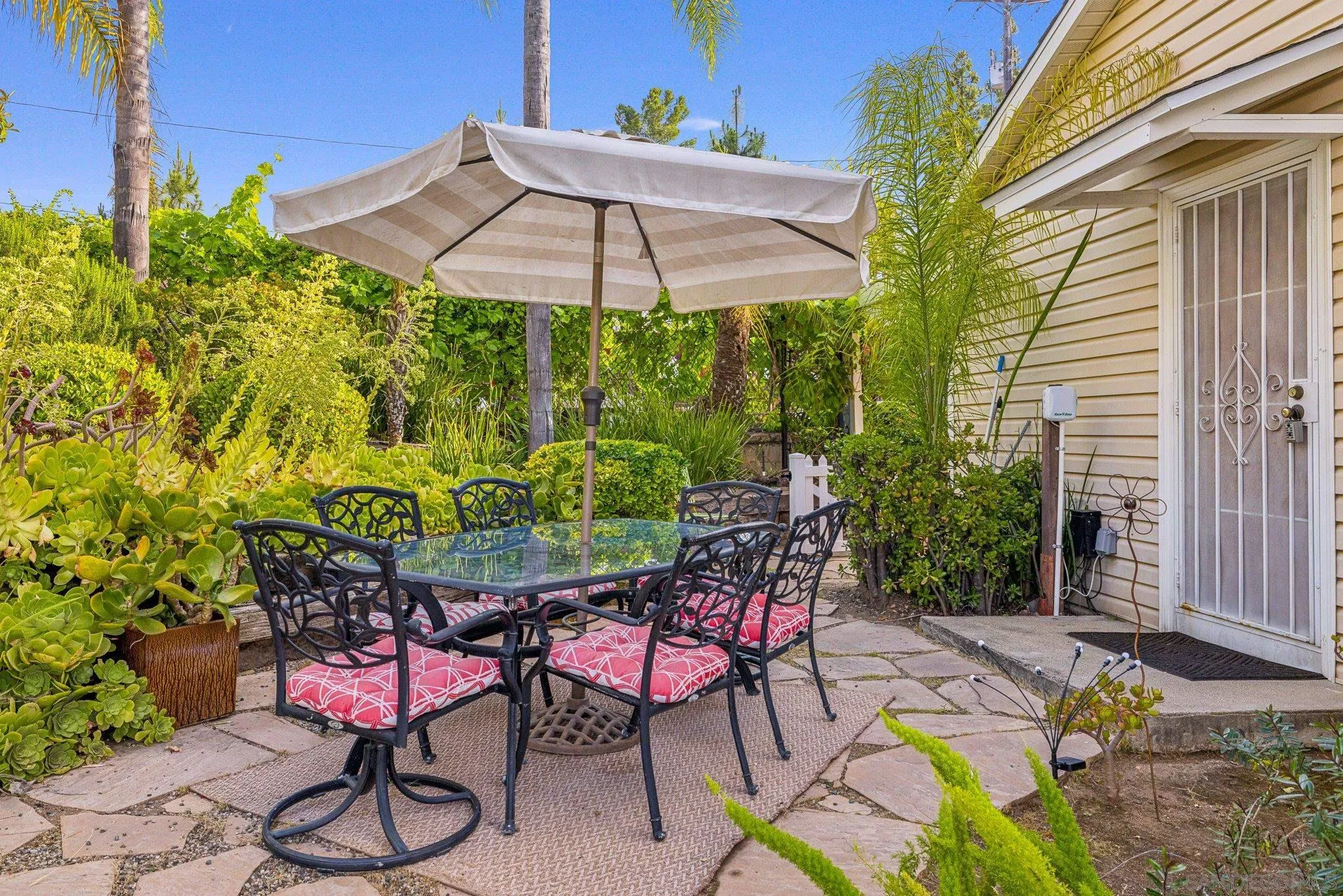 1350 Marshall Road Alpine, CA 91901 - Photo 7 of 23 a patio with a table and chairs under an umbrella