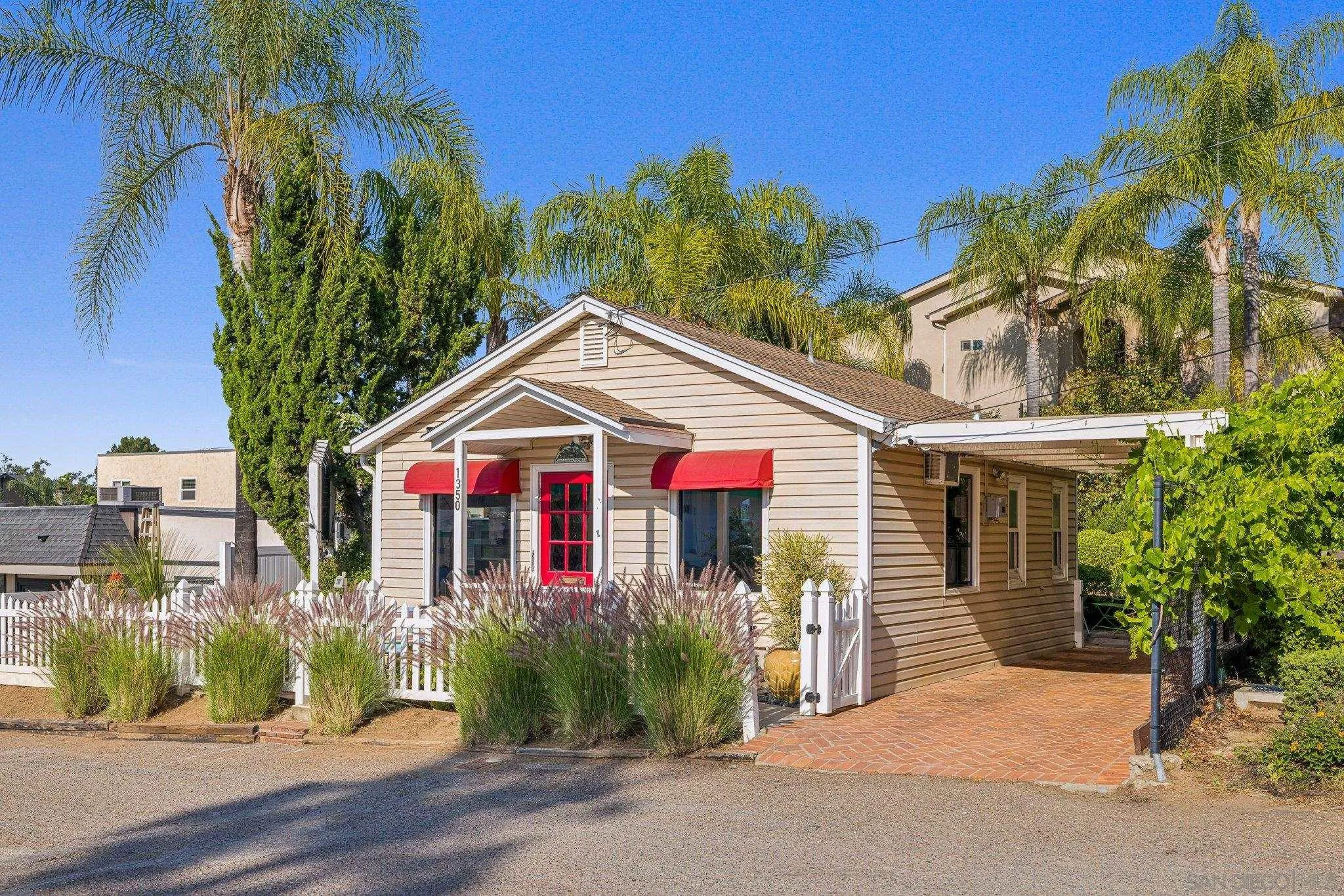 1350 Marshall Road Alpine, CA 91901 - Photo 10 of 23 a view of a white house with a small yard and a large tree
