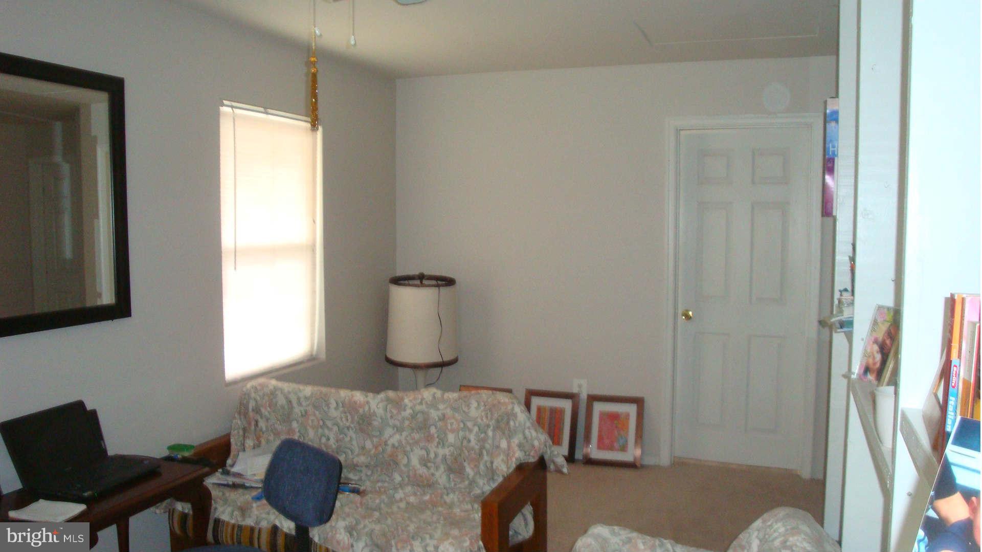 2505 Weisman Road Silver Spring, MD 20902 - Photo 15 of 19 a living room with furniture and a window