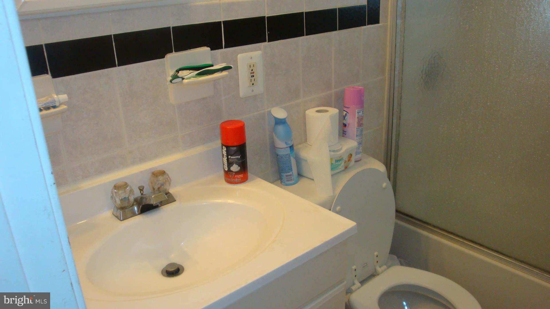 2505 Weisman Road Silver Spring, MD 20902 - Photo 18 of 19 a bathroom with a tub sink and toilet
