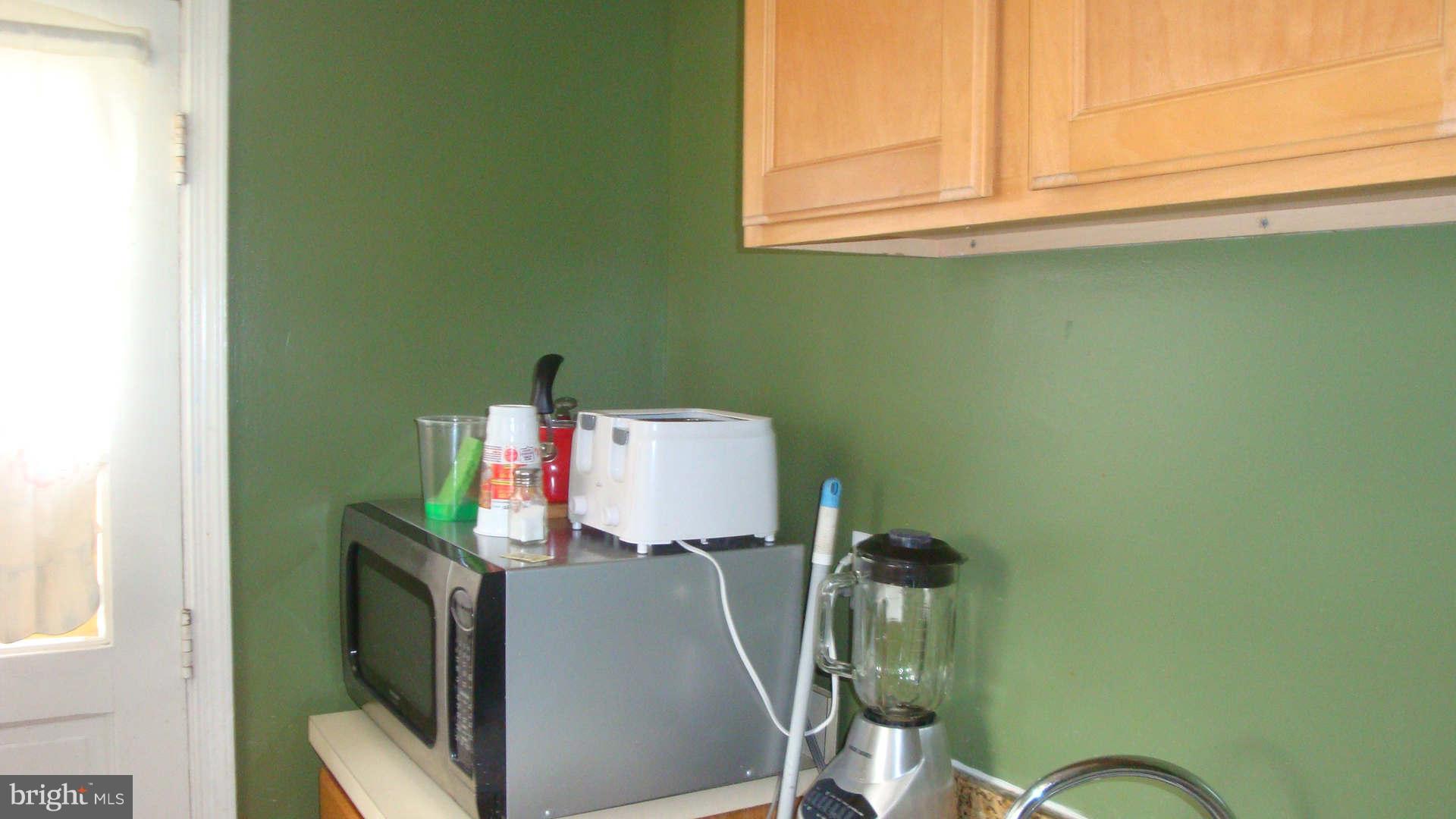 2505 Weisman Road Silver Spring, MD 20902 - Photo 8 of 19 a room with furniture and a mirror