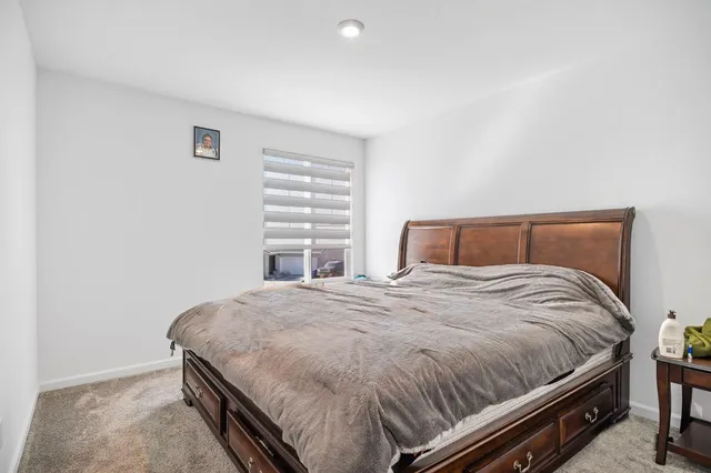 a bathroom with a sink mirror toilet and shower