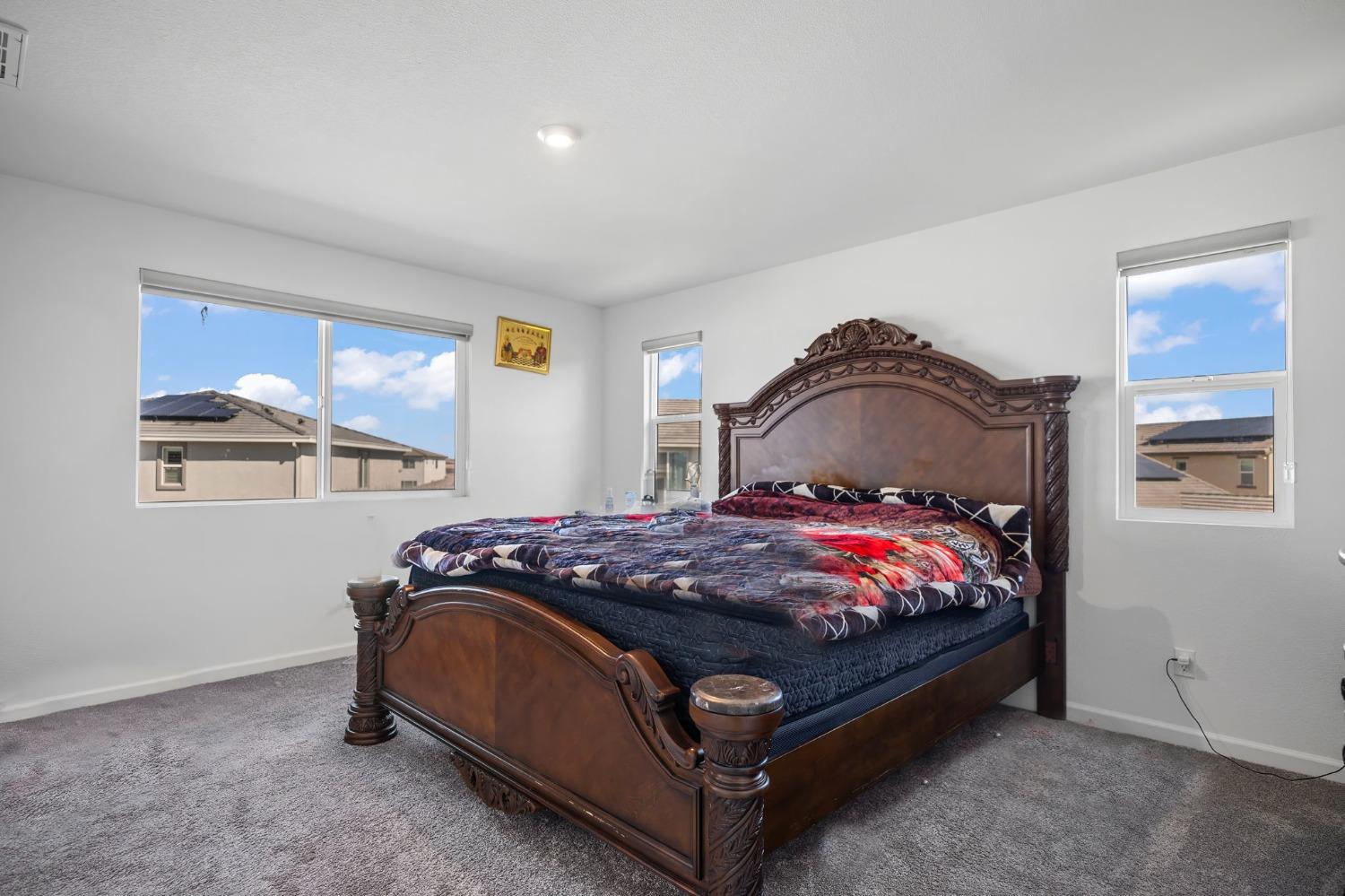 2883 Pixley Court Manteca, CA 95337 - Photo 24 of 42 a bedroom with a bed and window