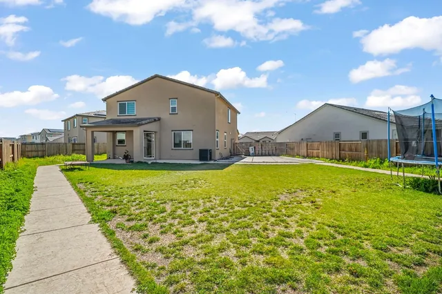 a house view with a garden space