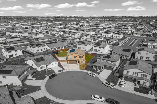 an aerial view of a swimming pool and outdoor seating