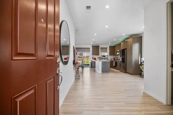 a view of a living room with stainless steel appliances granite countertop furniture
