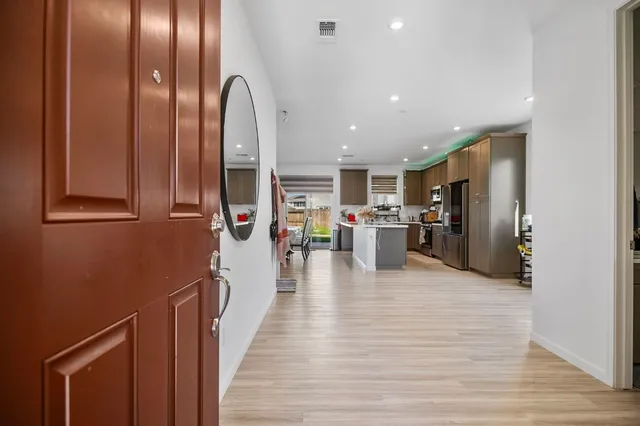 a view of a living room with stainless steel appliances granite countertop furniture