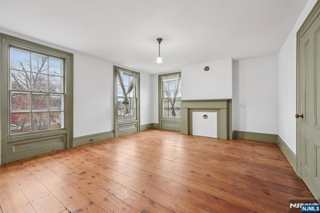 142 Island Road Mahwah, NJ 07430 - Photo 28 of 46 a view of an empty room with a window and fireplace
