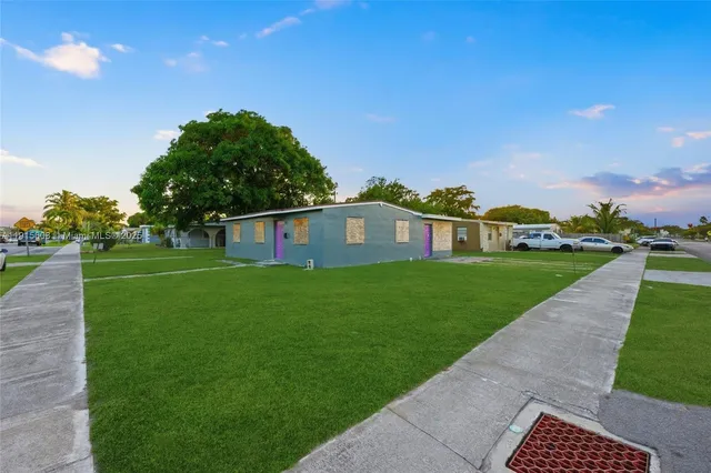 a view of a house with a big yard