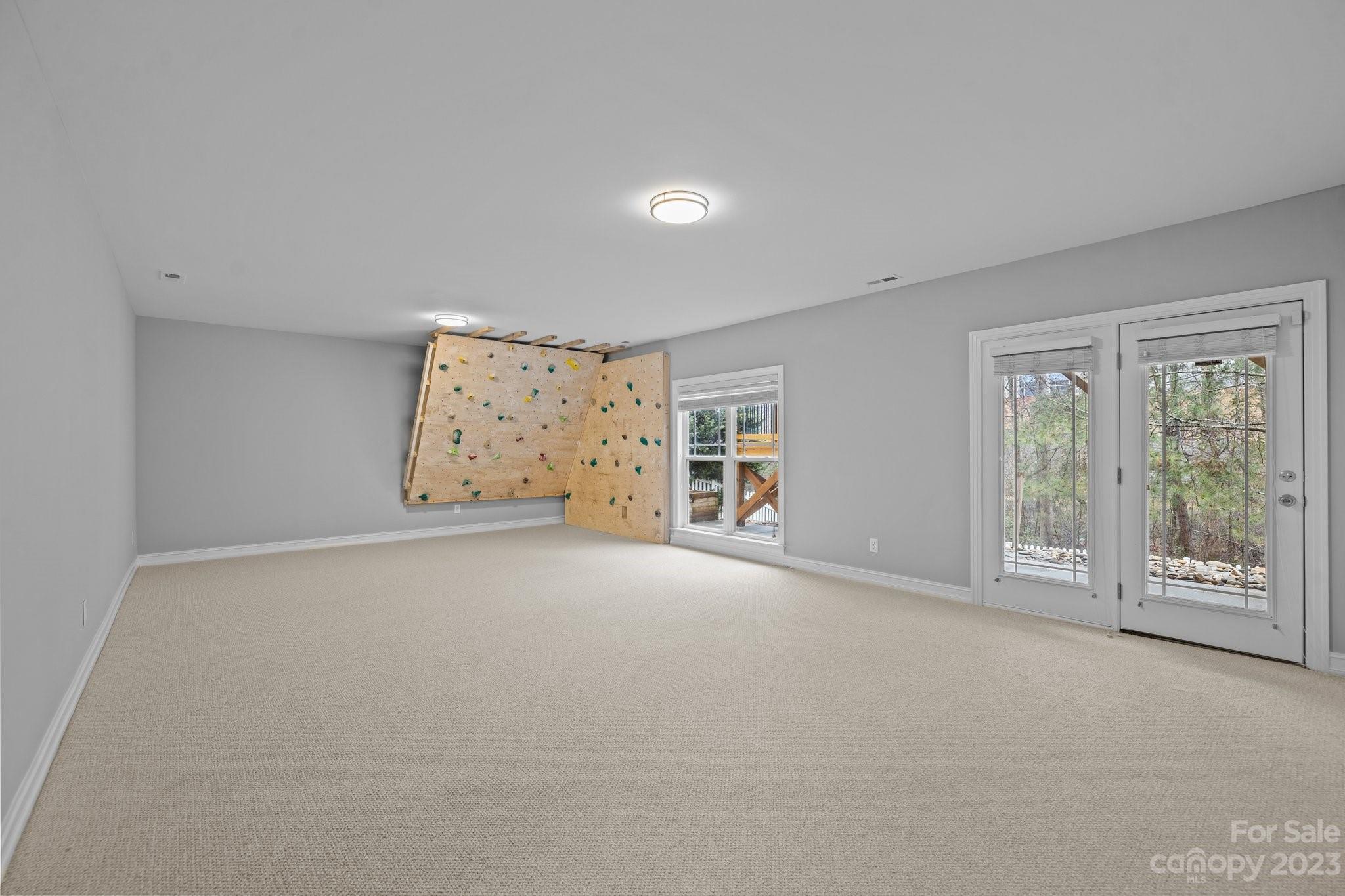 10304 Glenmeade Road Cornelius, NC 28031 - Photo 17 of 47 a view of an empty room with a window