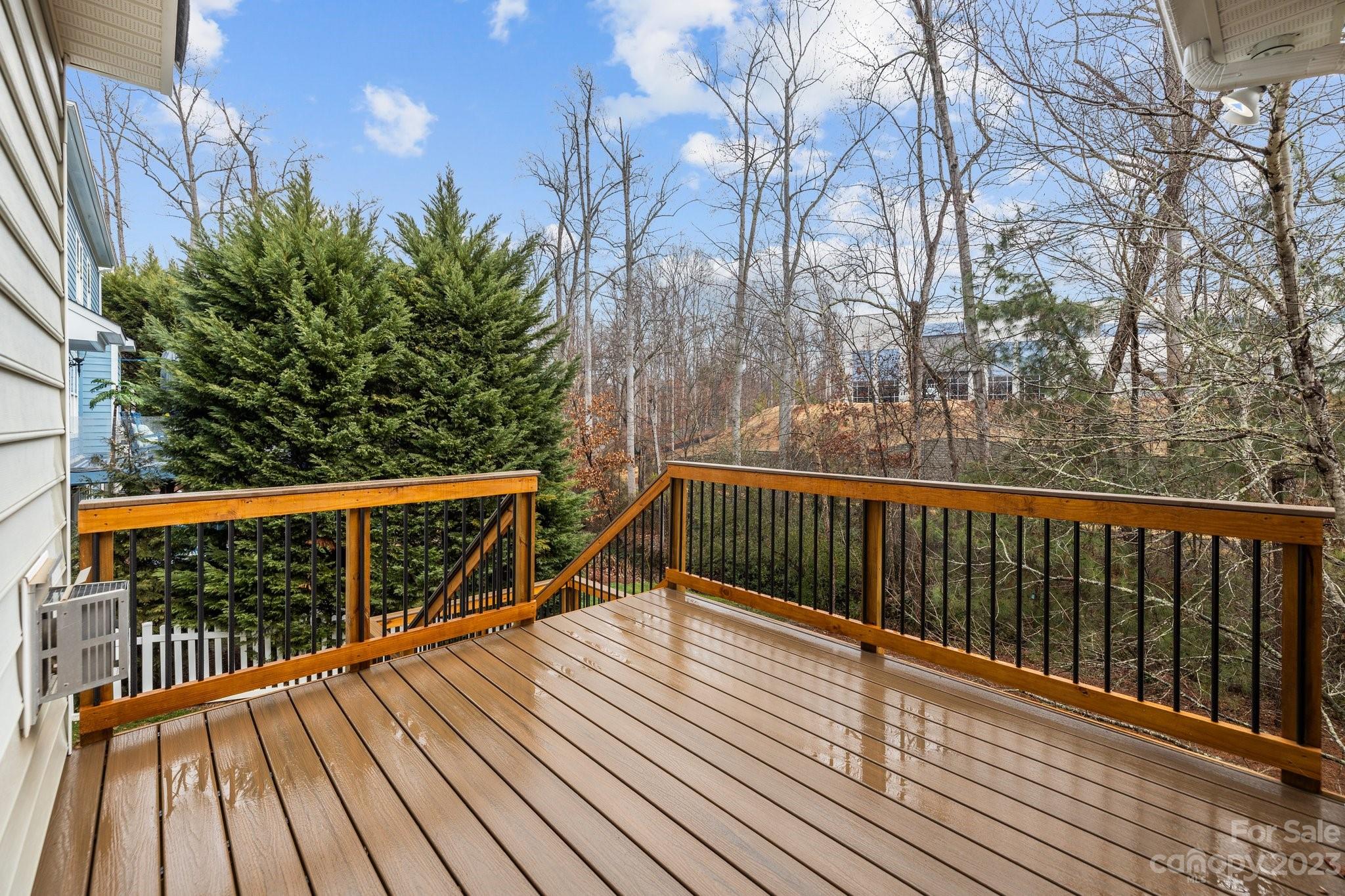 10304 Glenmeade Road Cornelius, NC 28031 - Photo 21 of 47 a view of balcony with wooden floor and fence