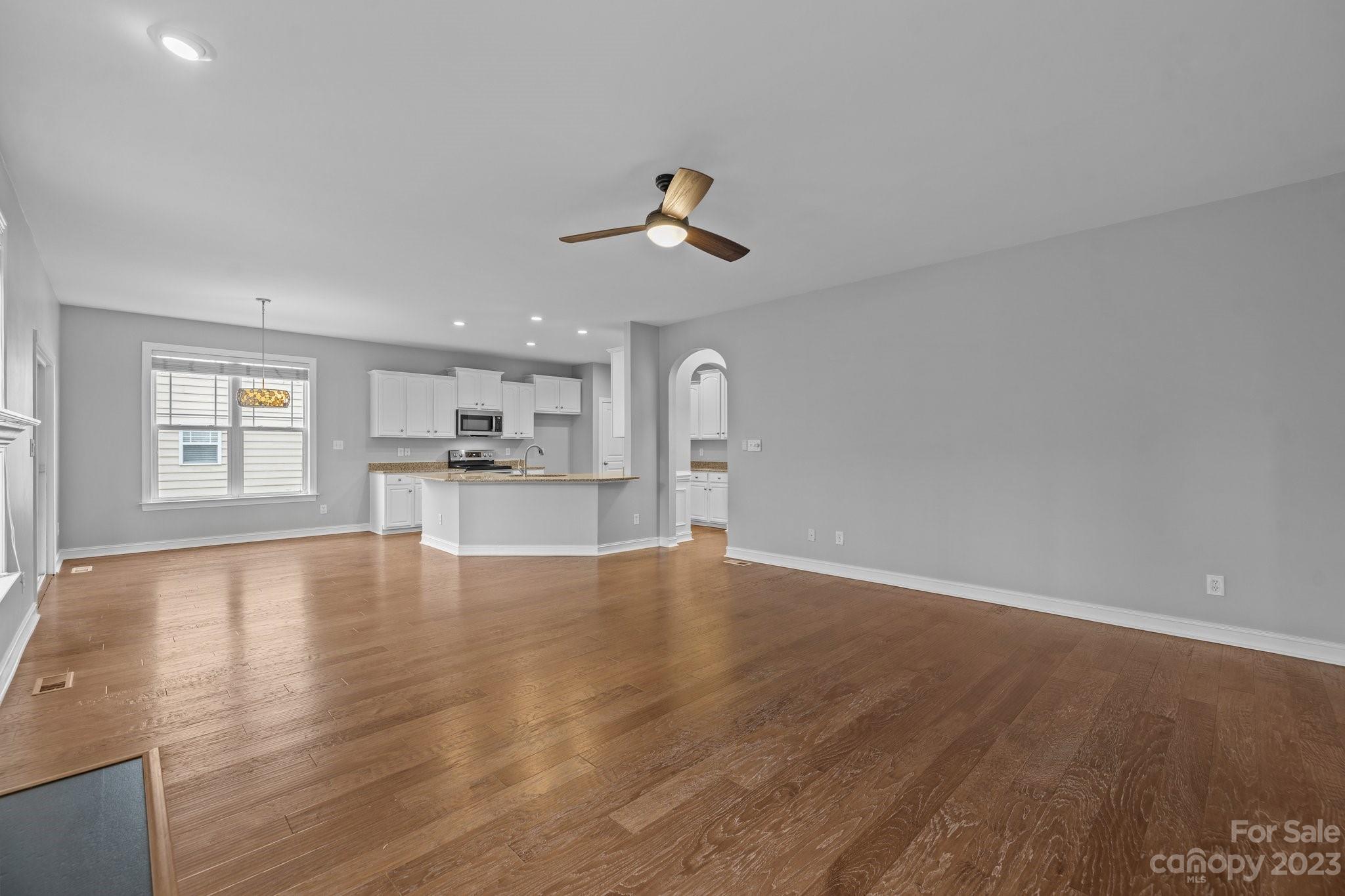 10304 Glenmeade Road Cornelius, NC 28031 - Photo 28 of 47 a view of a kitchen with wooden floor and a kitchen