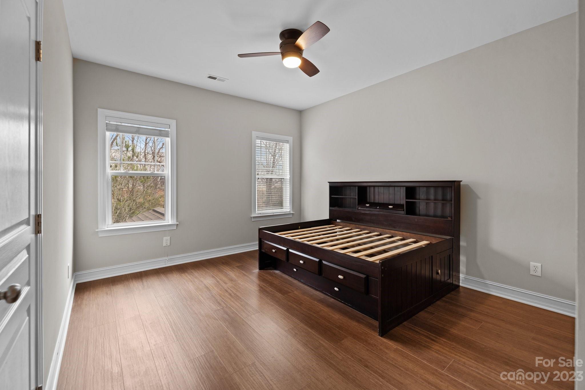 10304 Glenmeade Road Cornelius, NC 28031 - Photo 35 of 47 a view of wooden floor and windows in a room