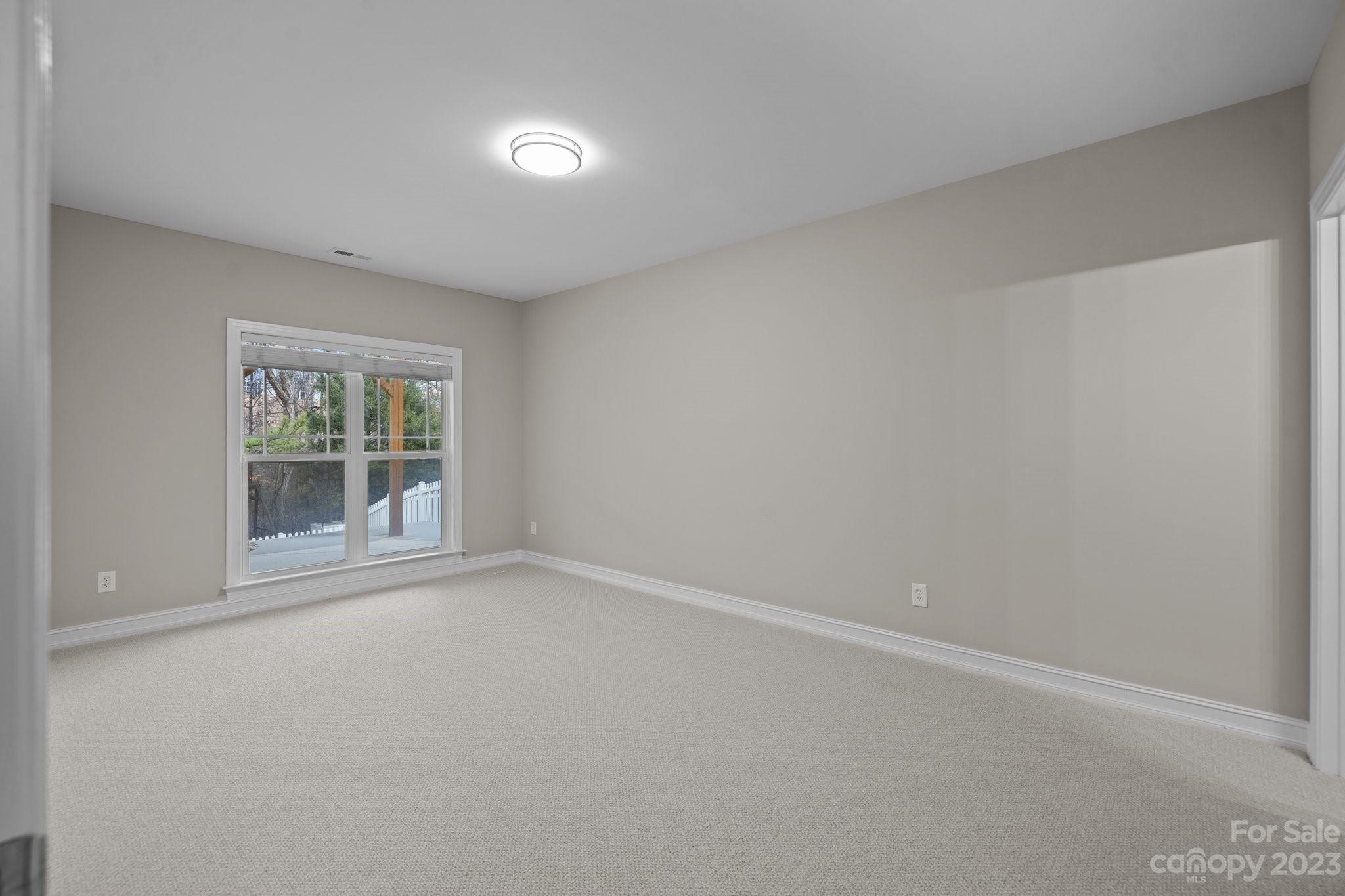 10304 Glenmeade Road Cornelius, NC 28031 - Photo 40 of 47 an empty room with a window