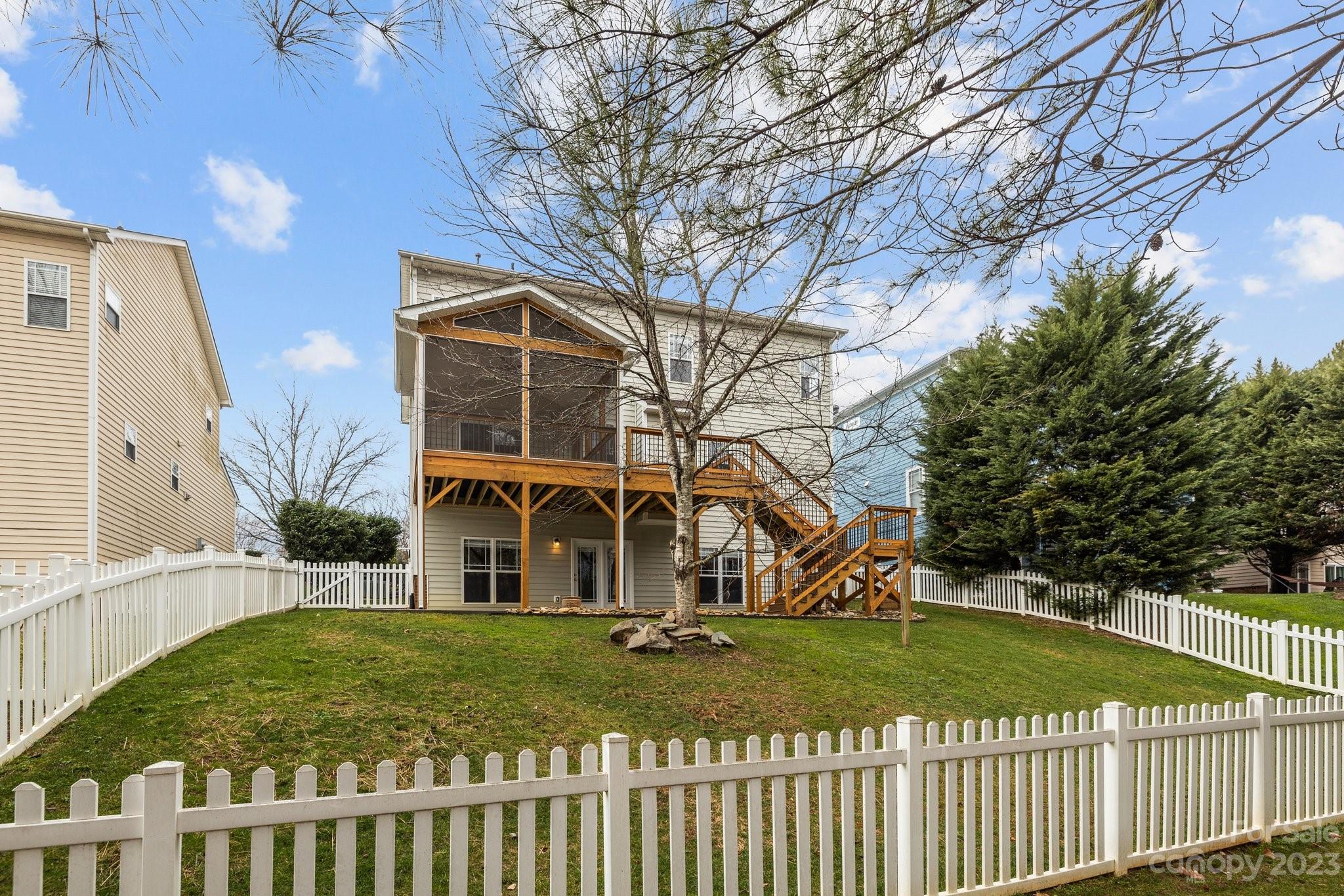 10304 Glenmeade Road Cornelius, NC 28031 - Photo 43 of 47 a view of a house with wooden fence