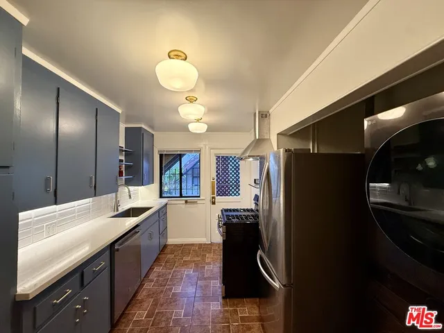 a bathroom with a tub a sink and a shower