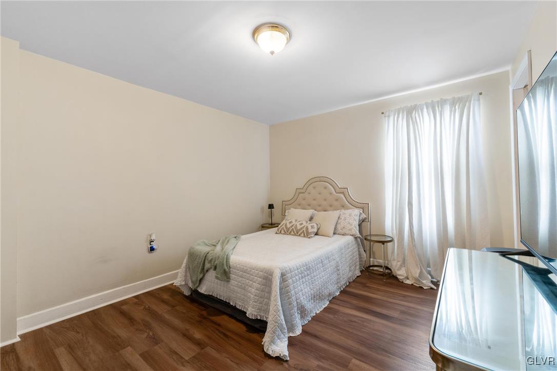 1226 Railroad Street Bethlehem, PA 18015 - Photo 12 of 20 a room with a bed and a mirror