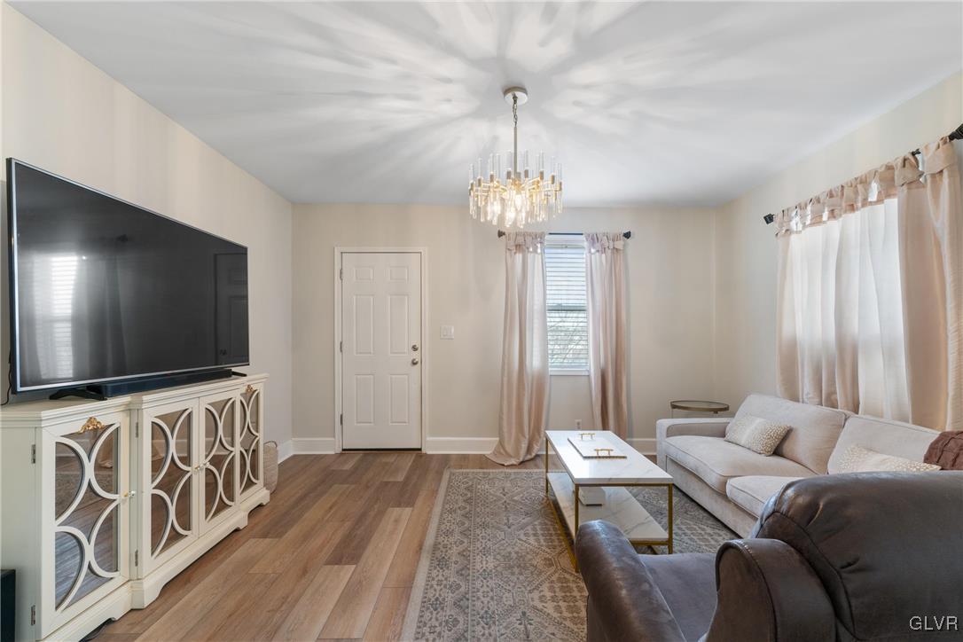 1226 Railroad Street Bethlehem, PA 18015 - Photo 2 of 20 a living room with furniture and a flat screen tv