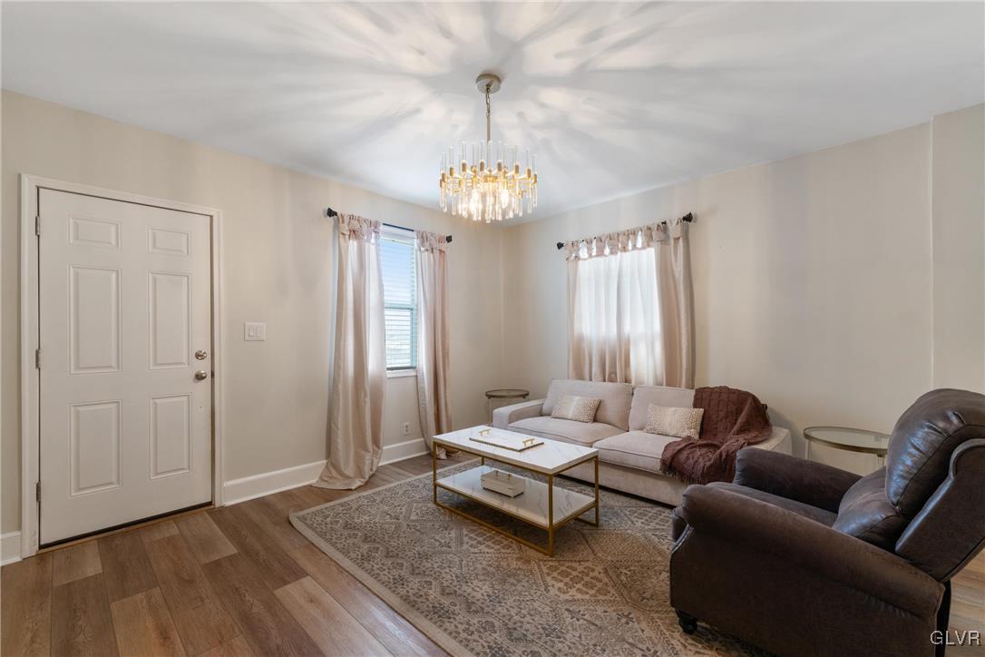 1226 Railroad Street Bethlehem, PA 18015 - Photo 3 of 20 a living room with furniture and a chandelier