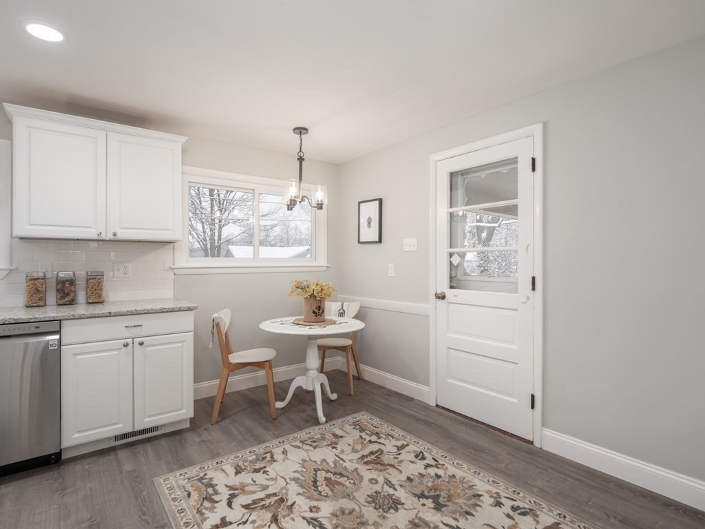 39 Marilyn Road Andover, MA 01810 - Photo 12 of 28 a kitchen with sink cabinets and dining table