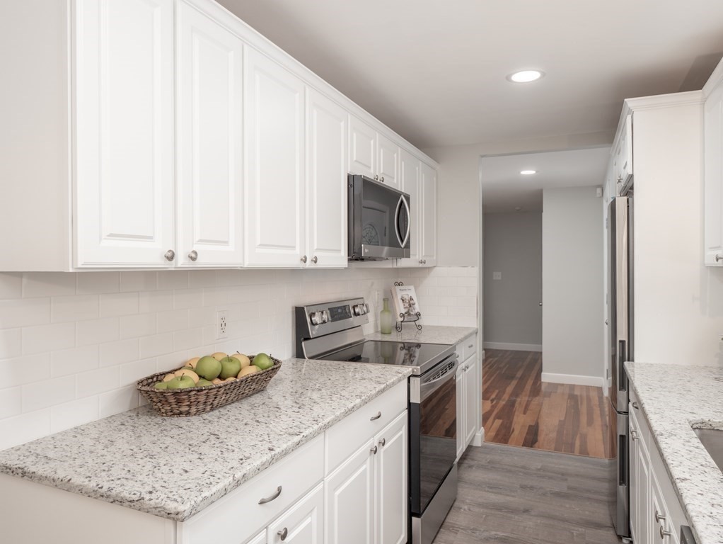 39 Marilyn Road Andover, MA 01810 - Photo 13 of 28 a kitchen with a sink and cabinets