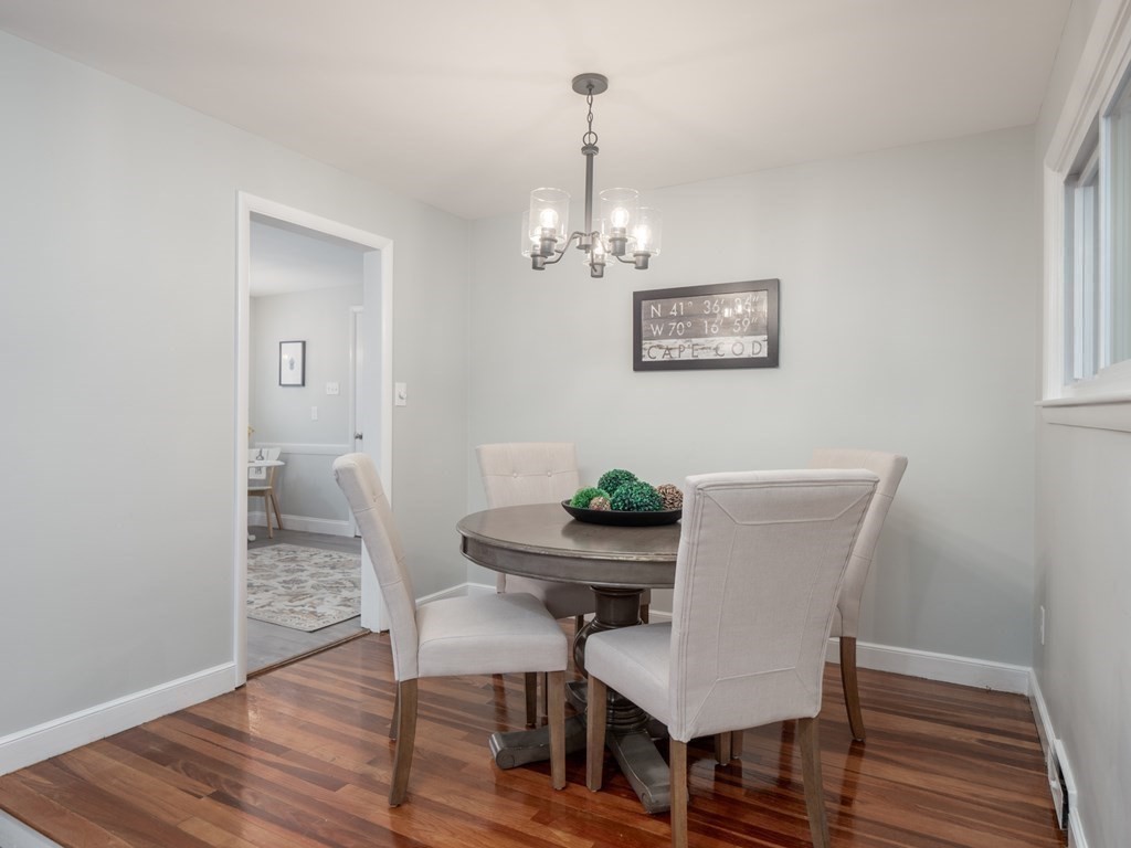 39 Marilyn Road Andover, MA 01810 - Photo 17 of 28 a view of a dining room with furniture wooden floor and a chandelier