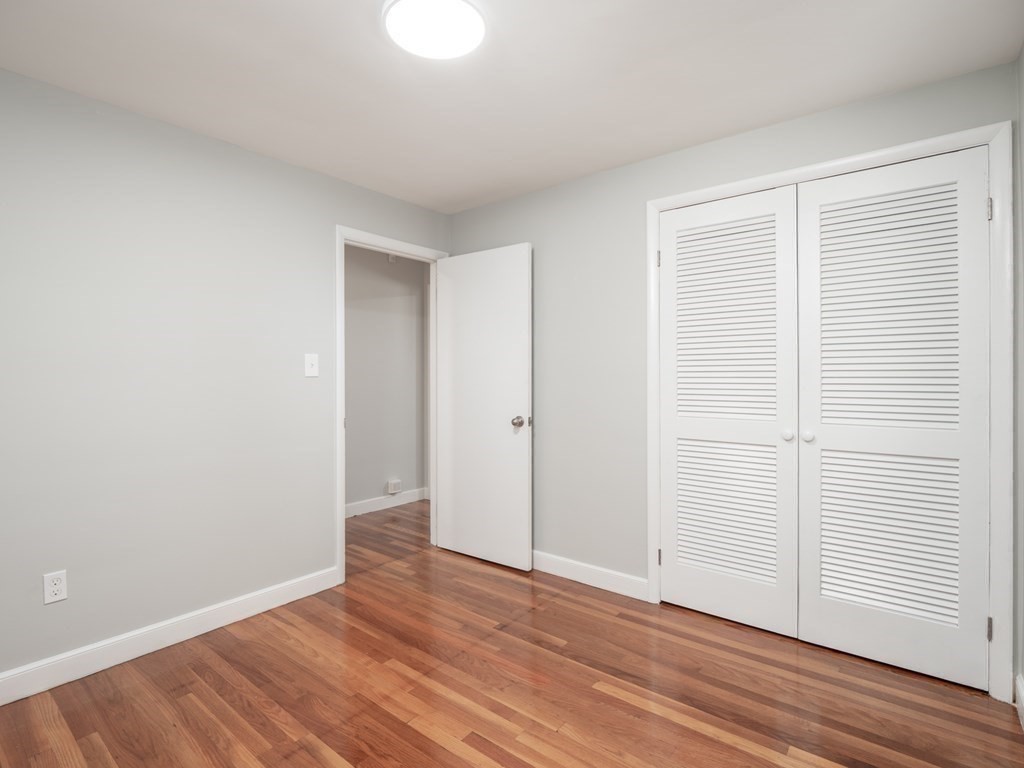 39 Marilyn Road Andover, MA 01810 - Photo 19 of 28 a view of an empty room with wooden floor