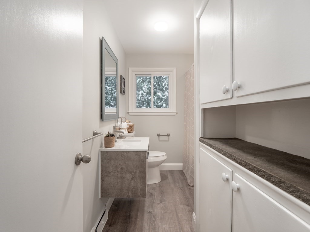 39 Marilyn Road Andover, MA 01810 - Photo 20 of 28 a bathroom with a sink a toilet and mirror