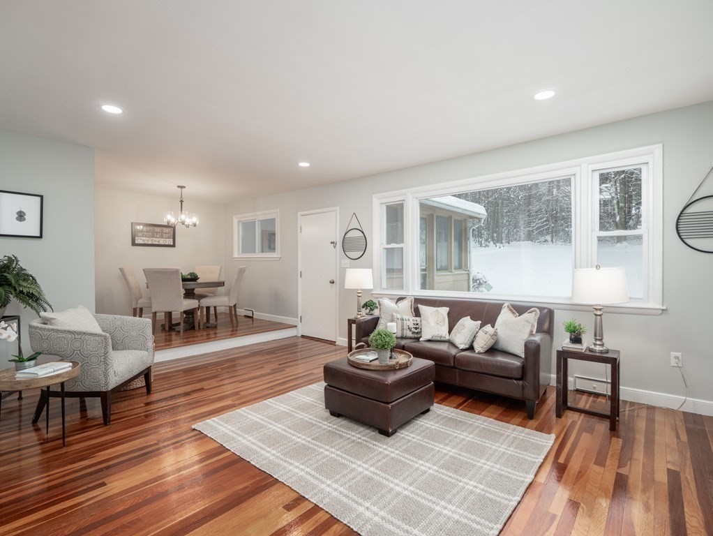 39 Marilyn Road Andover, MA 01810 - Photo 2 of 28 a living room with furniture and a table