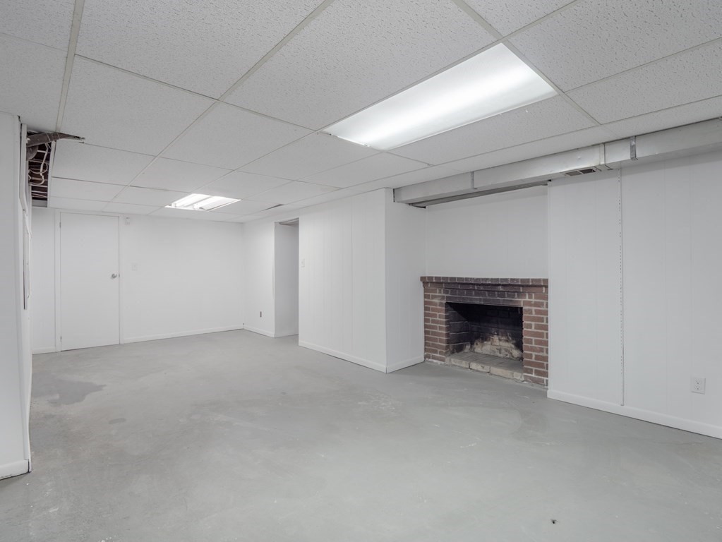 39 Marilyn Road Andover, MA 01810 - Photo 27 of 28 a view of an empty room with a fireplace