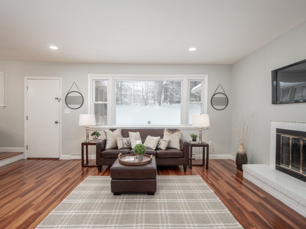 39 Marilyn Road Andover, MA 01810 - Photo 3 of 28 a living room with furniture and a fireplace