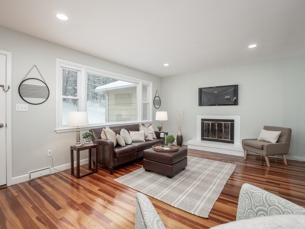39 Marilyn Road Andover, MA 01810 - Photo 6 of 28 a living room with furniture and a fireplace
