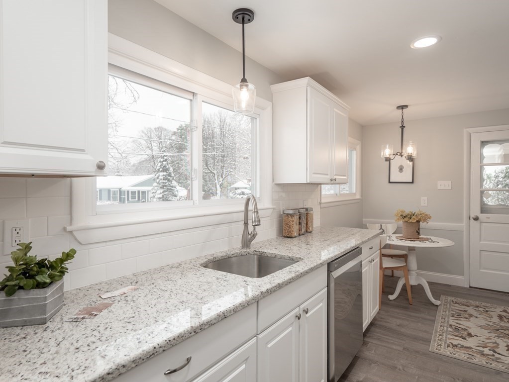 39 Marilyn Road Andover, MA 01810 - Photo 8 of 28 a kitchen with a sink window and cabinets