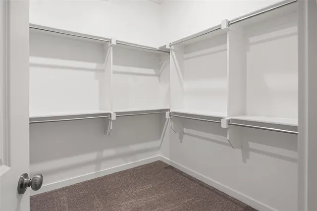 a bathroom with a shower sink and mirror