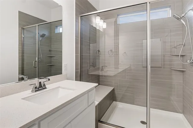 an empty room with closet and wooden shelves