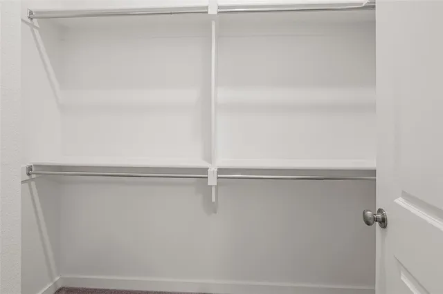 a view of storage and utility room with washer and dryer